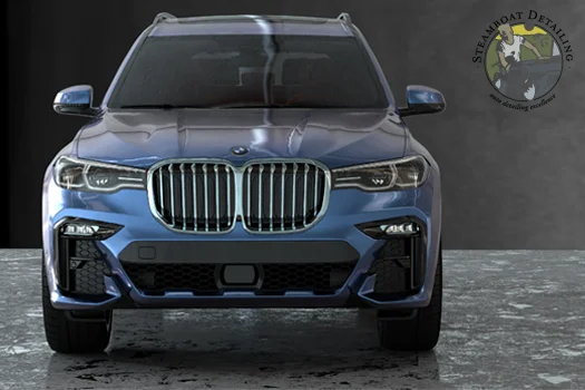 A close-up of BMW X7 on a gray background.